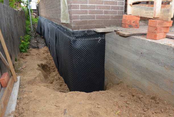 Happy homeowners after waterproofing job in Mount Royal